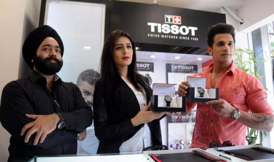 L-R Kanwarjeet Singh, owner, Standard Times with Prince and Anuki launching Tissot Quickster